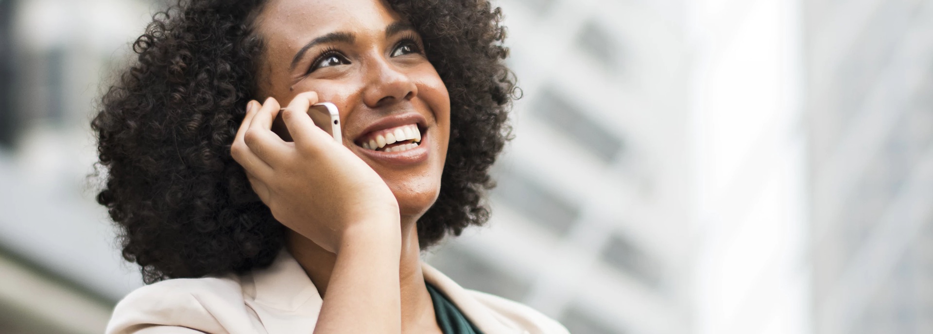 Woman happily speaking on the phone